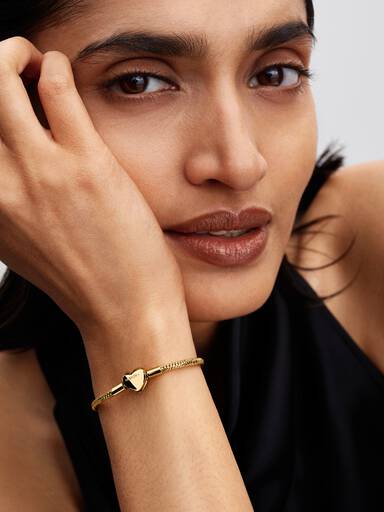 Snake-chain armband met facet geslepen schakels en hartsluiting