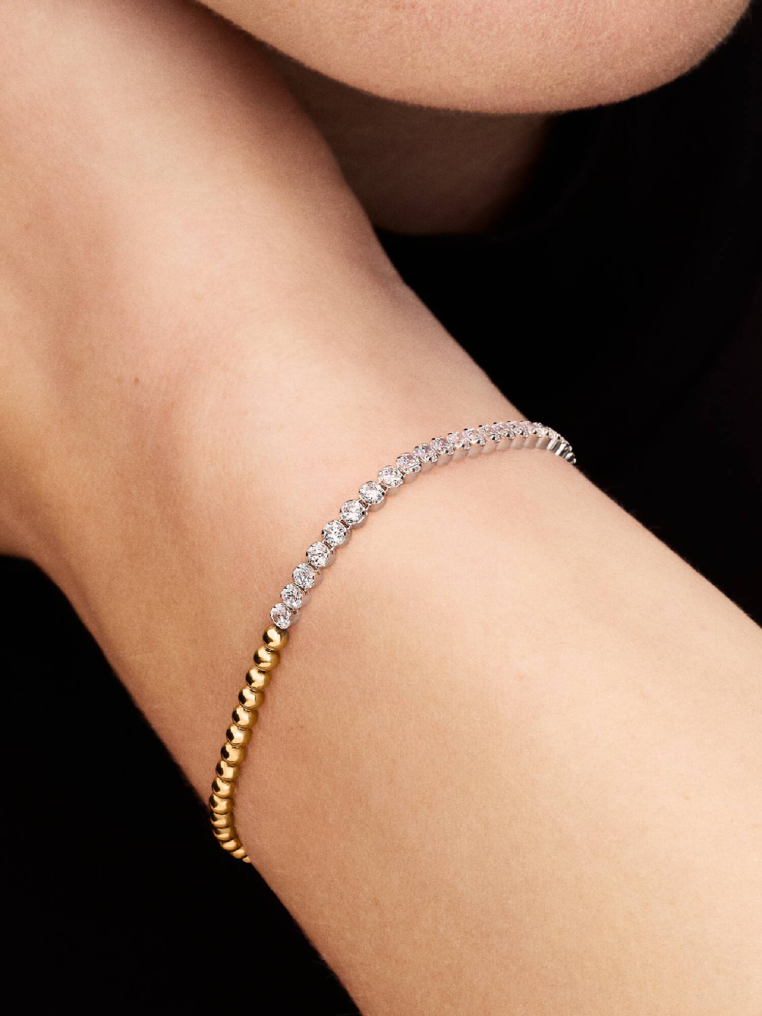 Kralen- en tennisarmband